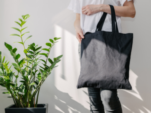 photo of a man holding a tote bag one of the essential reading accessories