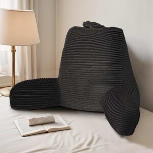 photo of a black reading pillow on a bed