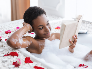 photo of women sitting in a bubble bath reading a book as an example for self care ideas for bookworms