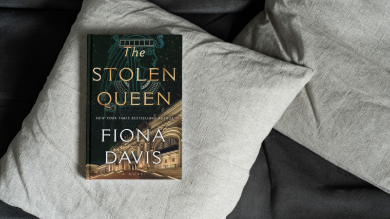 photo of the stolen queen by fiona davis on a couch pillow