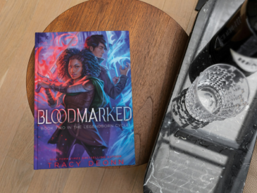 book bloodmarkd by tracy deonn on a coffee table