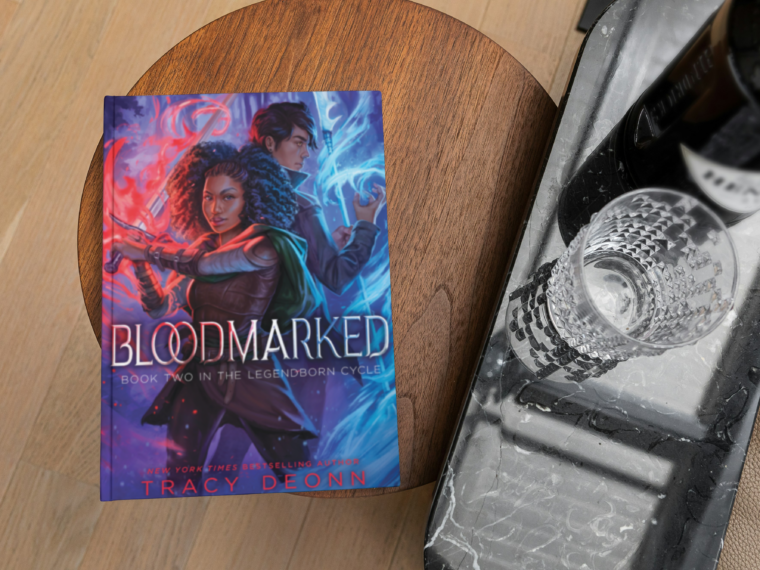 book bloodmarkd by tracy deonn on a coffee table