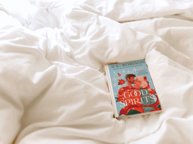 the book good spirits by b.k. borison laying on a comforter of a bed